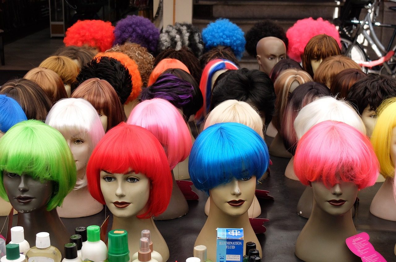 Wacky sports dress-up image of mannequin heads with wigs on