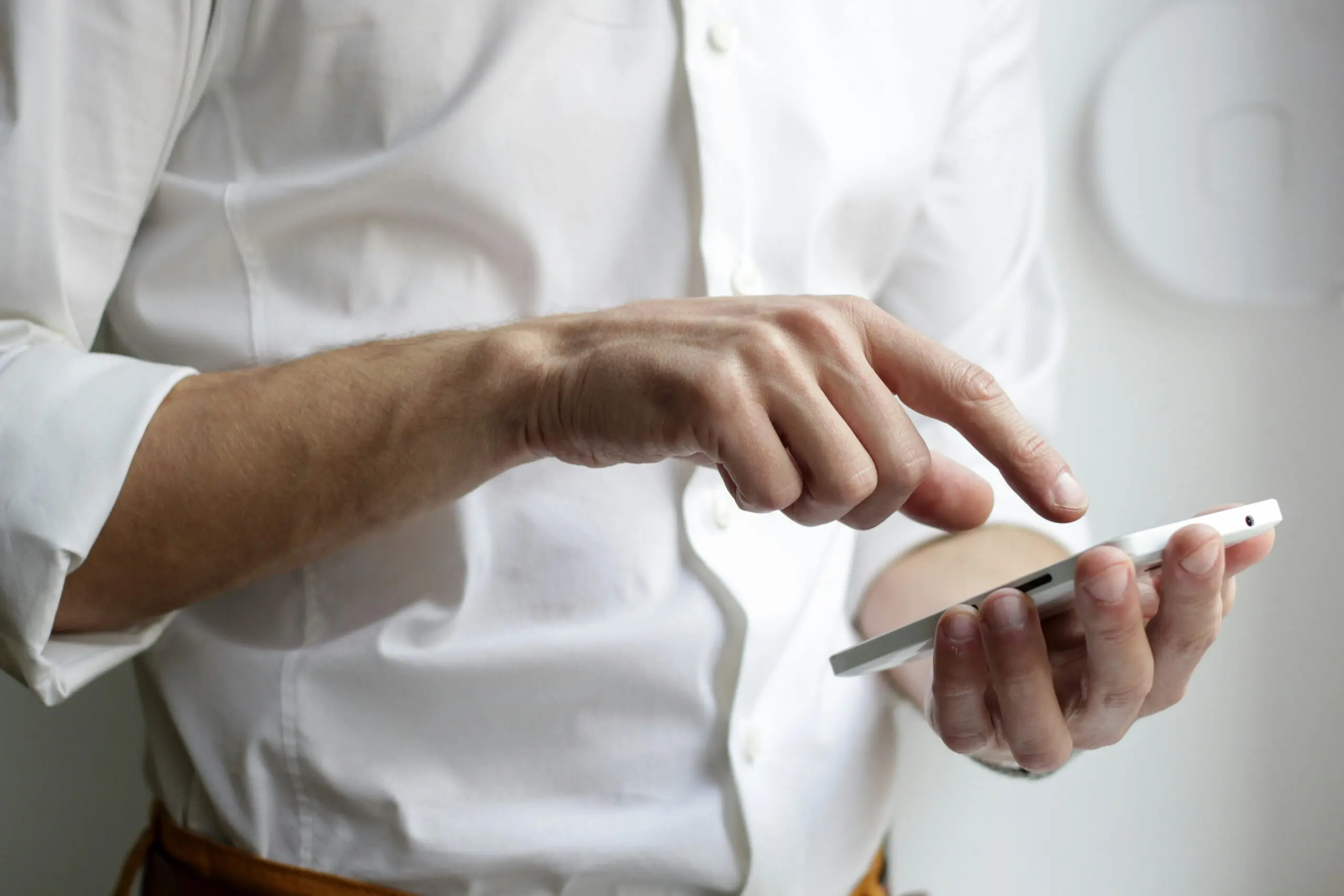 Progressive jackpot slots: Man looking at phone